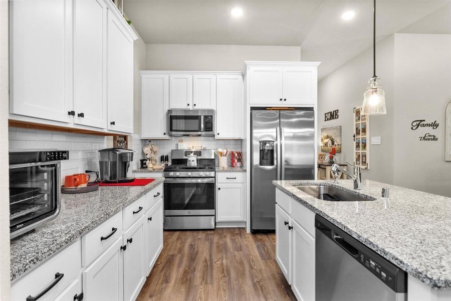Another view of the kitchen showing all the cabinet space to store all your kitchen goodies and gadgets. Notice the cabinetry above and on the sides of the refrigerator. The Sellers had this added for extra storage space and for aesthetic design surrounding the refrigerator really upgrading the overall feel of this space. Another view of the kitchen showing all the cabinet space to store all your kitchen goodies and gadgets. Notice the cabinetry above and on the sides of the refrigerator. The Sellers had this added for extra storage space and for aesthetic design surrounding the refrigerator really upgrading the overall feel of this space.