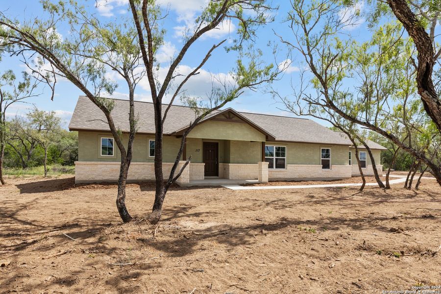 Front exterior of a new home in , Pleasanton, TX, highlighting curb appeal (Image 2). Front exterior of a new home in , Pleasanton, TX, highlighting curb appeal (Image 2).