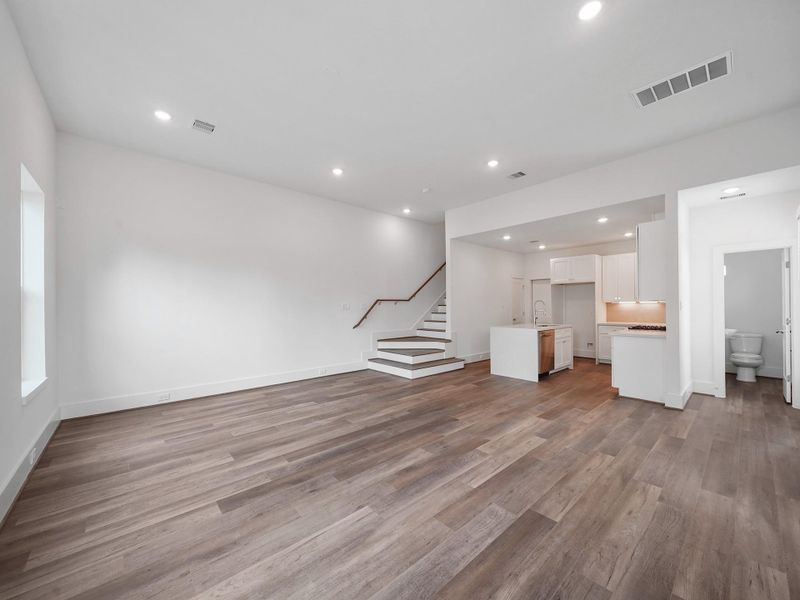 Experience modern elegance in this spacious, light-filled home featuring stunning hardwood floors, a sleek open-plan kitchen, and a stylish staircase—ideal for contemporary living in a vibrant community.Photo Disclaimer: Photos are representative of the community and may depict a similar floor plan, model home, or previously completed residence.