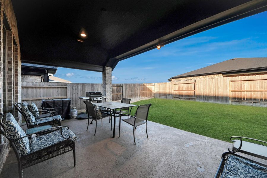 Covered patio perfect for grilling or relaxing Covered patio perfect for grilling or relaxing