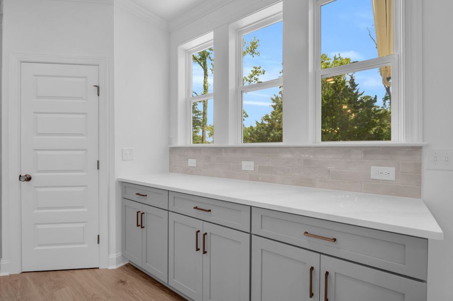Representative furnished interior of a home built from the The Highland by RobuckHomes in Windwater, Hampstead (Image 17).