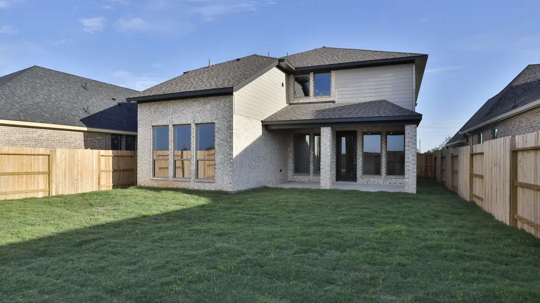 Exterior details and patio area of a home in Lakes of Cane Island, Katy (Image 2). Exterior details and patio area of a home in Lakes of Cane Island, Katy (Image 2).