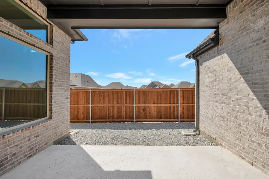 Exterior details and patio area of a home in Elements at Viridian - Garden Series, Arlington (Image 3). Exterior details and patio area of a home in Elements at Viridian - Garden Series, Arlington (Image 3).