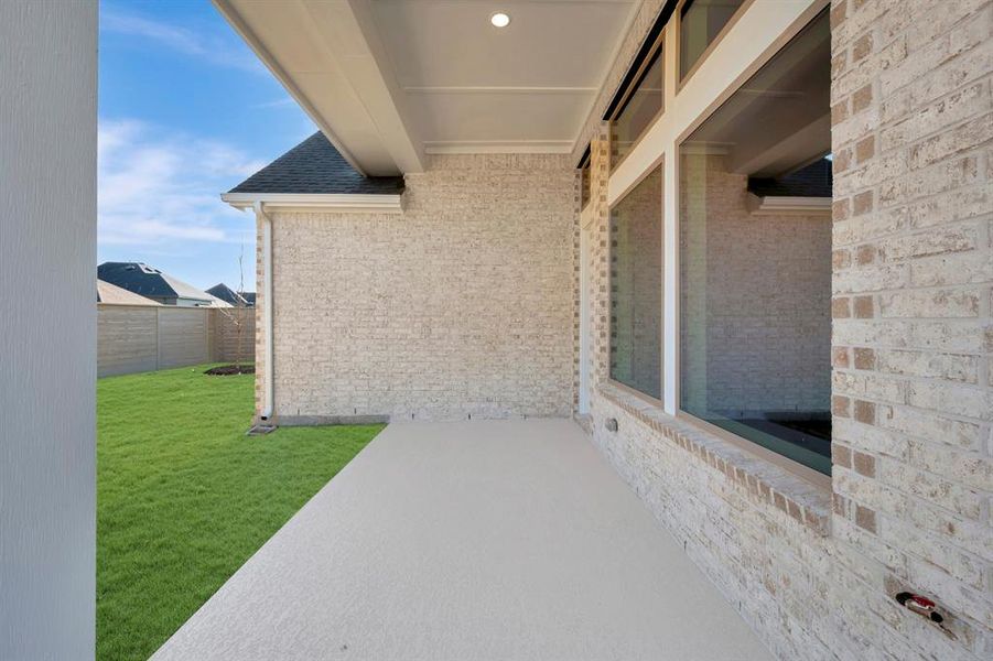 Exterior details and patio area of a home in Treeline, Justin (Image 2).