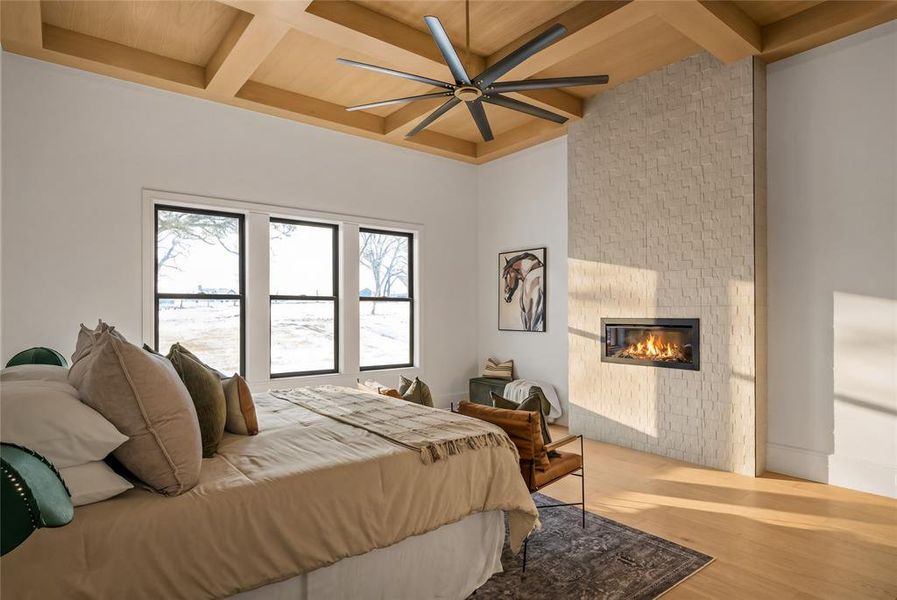 Wood-finish coffered ceiling featuring a contemporary ceiling fan