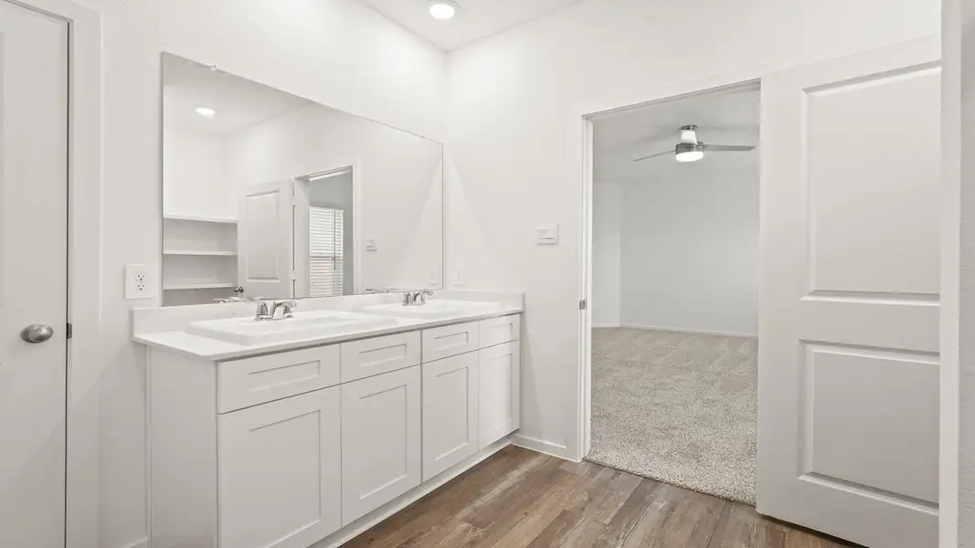 Furnished interior view inside a new home in Sunterra, Katy (Image 8).