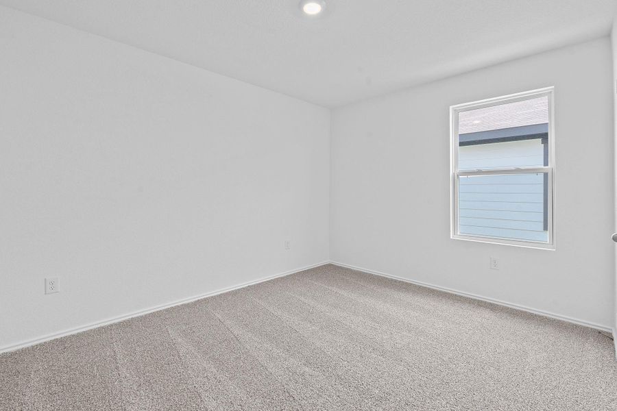 Empty room featuring carpet floors and recessed lighting Empty room featuring carpet floors and recessed lighting