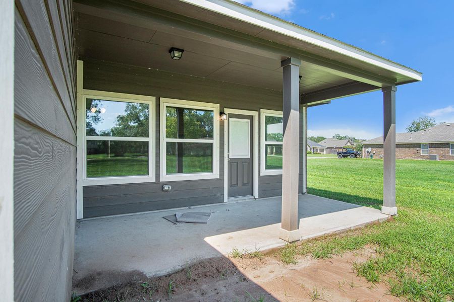 Front exterior of a new home in Columbia Lakes, West Columbia, TX, highlighting curb appeal (Image 2). Front exterior of a new home in Columbia Lakes, West Columbia, TX, highlighting curb appeal (Image 2).