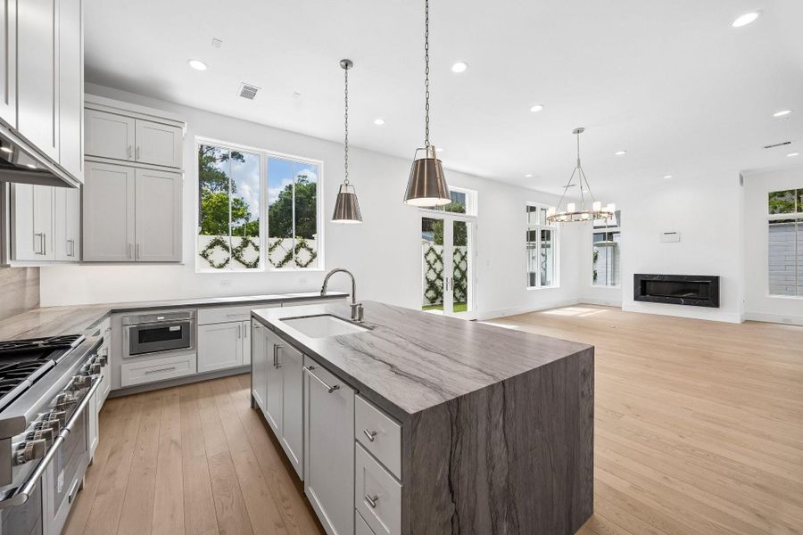 Spacious island overlooks the bright and inviting living area.