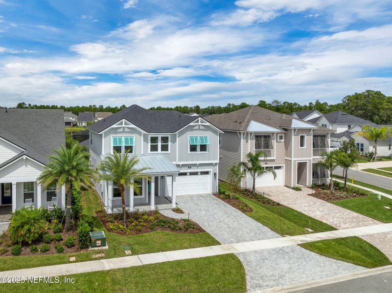 Front exterior of a new home in Seabrook Village at Seabrook, Ponte Vedra, FL, highlighting curb appeal (Image 1).