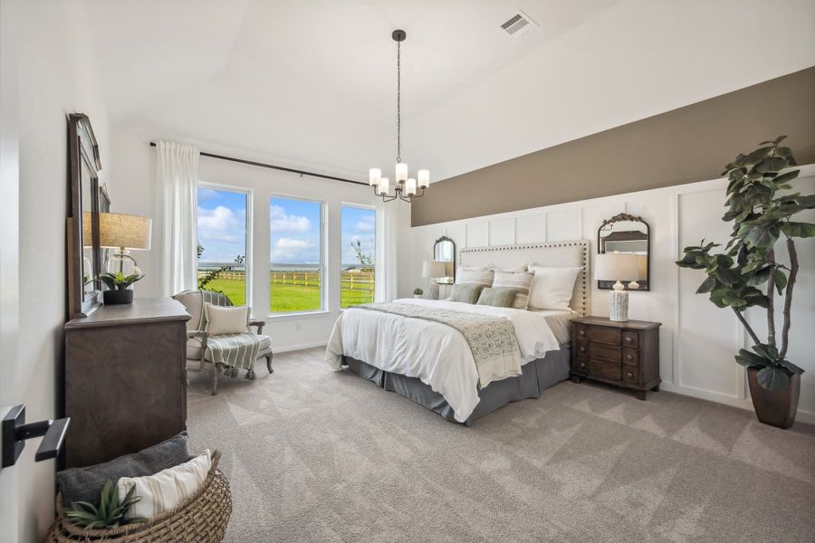 Primary suite with sloped ceiling Primary suite with sloped ceiling