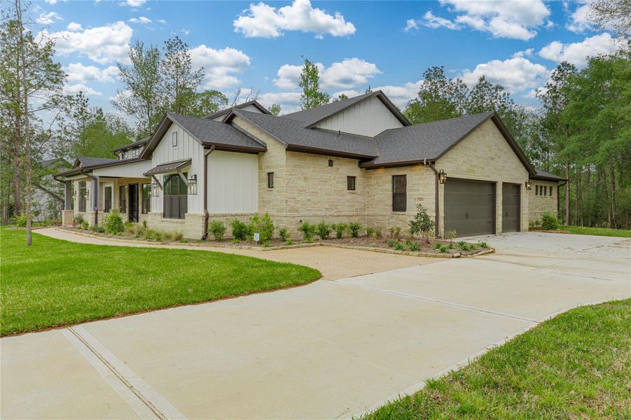 Three car garage and plenty of additional parking space in the double wide long private driveway.  Plenty of room on the lot to build a workshop or boat/rv house.