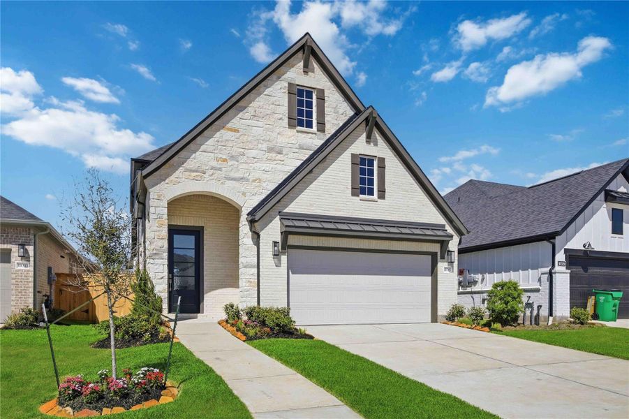Front exterior of a new home in Sienna, Missouri City, TX, highlighting curb appeal (Image 9).