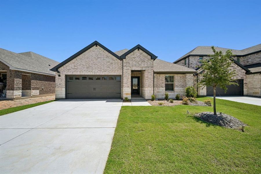 Front exterior of a new home in Parks at Foster Crossing - Signature Series, Anna, TX, highlighting curb appeal (Image 1). Front exterior of a new home in Parks at Foster Crossing - Signature Series, Anna, TX, highlighting curb appeal (Image 1).