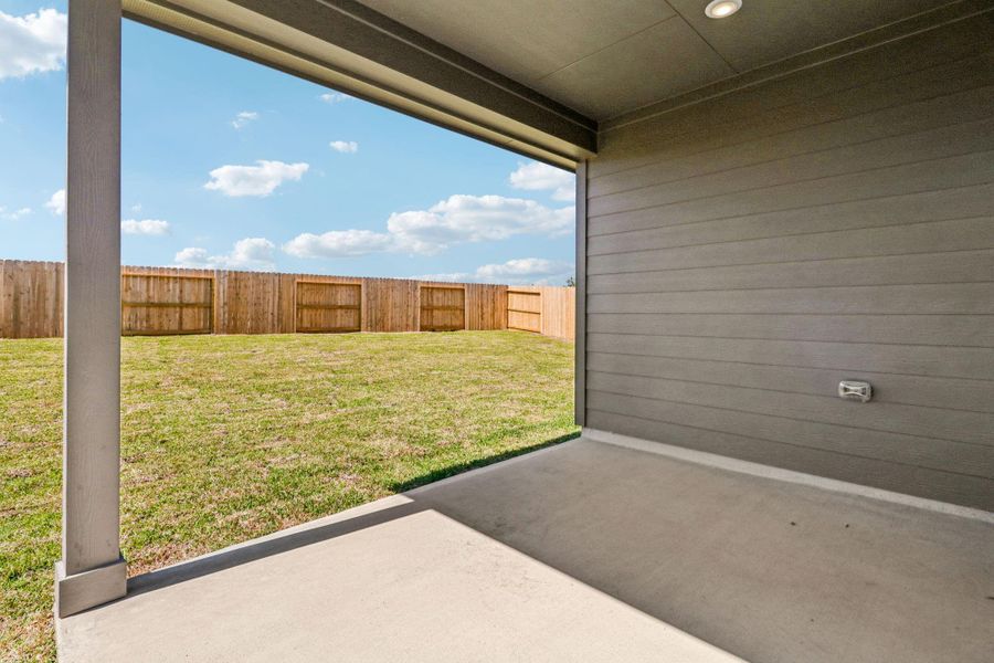 Exterior details and patio area of a home in Granger Pointe - Traditional Series, New Caney (Image 3).