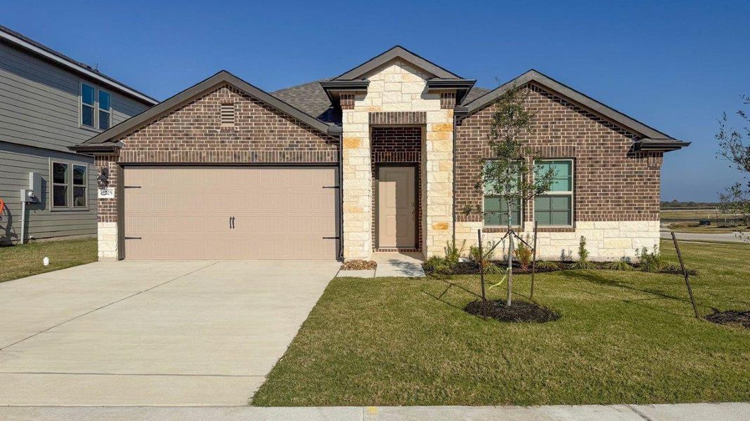 Front exterior of a new home in Southern Pointe, College Station, TX, highlighting curb appeal (Image 1). Front exterior of a new home in Southern Pointe, College Station, TX, highlighting curb appeal (Image 1).