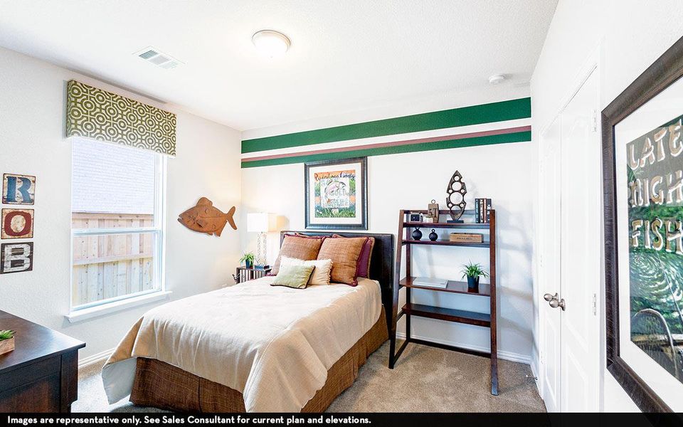 Bedroom featuring carpet floors and baseboards Bedroom featuring carpet floors and baseboards