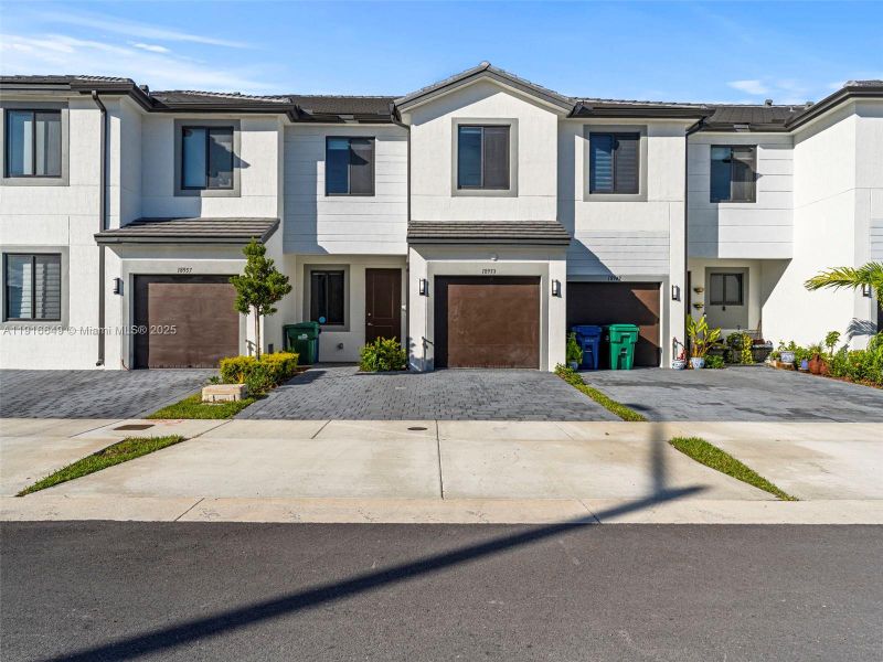 Front exterior of a new home in , Homestead, FL, highlighting curb appeal (Image 2). Front exterior of a new home in , Homestead, FL, highlighting curb appeal (Image 2).
