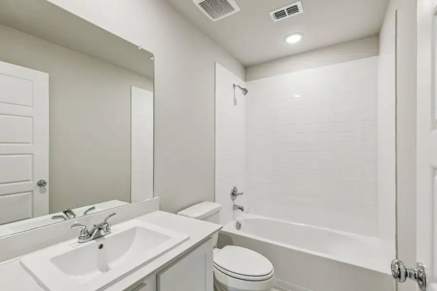Bathroom in the Harper home plan by Trophy Signature Homes – REPRESENTATIVE PHOTO