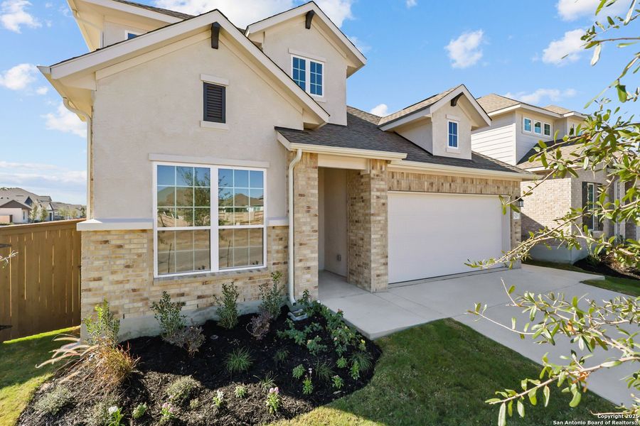 Front exterior of a new home in Stillwater Ranch, San Antonio, TX, highlighting curb appeal (Image 2). Front exterior of a new home in Stillwater Ranch, San Antonio, TX, highlighting curb appeal (Image 2).