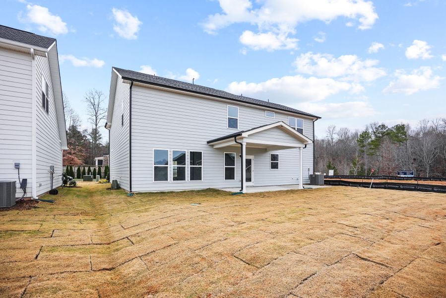 Exterior details and patio area of a home in Forest Creek, Waxhaw (Image 29).