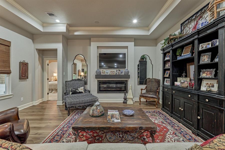 A framed niche above the fireplace provides the perfect space for a TV, complemented by a floating wood mantel. Together, they create a cozy and inviting ambiance in this living space. A framed niche above the fireplace provides the perfect space for a TV, complemented by a floating wood mantel. Together, they create a cozy and inviting ambiance in this living space.