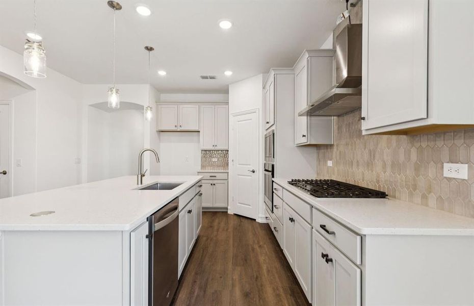 High-end gourmet kitchen with premium finishes and upgraded appliances *Real home pictured High-end gourmet kitchen with premium finishes and upgraded appliances *Real home pictured