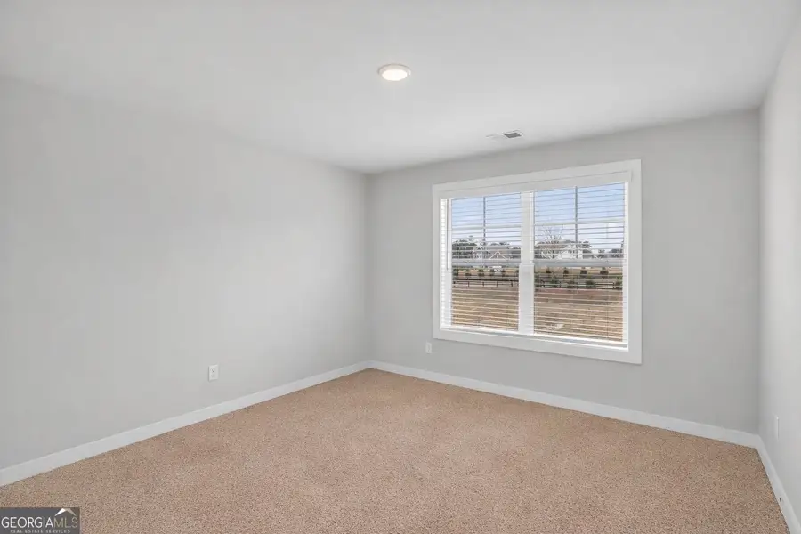 Spacious, unfurnished interior of a new home in The Fairways at Mirror Lake, Villa Rica (Image 35). Spacious, unfurnished interior of a new home in The Fairways at Mirror Lake, Villa Rica (Image 35).