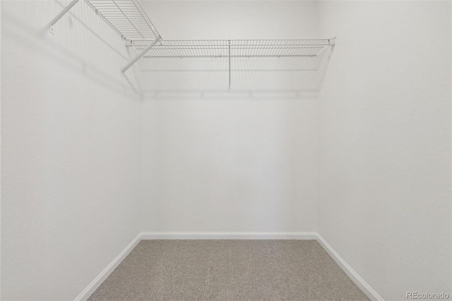 Upper Level: Primary Bedroom Walk-In Closet Upper Level: Primary Bedroom Walk-In Closet