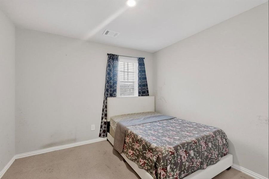 Bedroom featuring carpet Bedroom featuring carpet