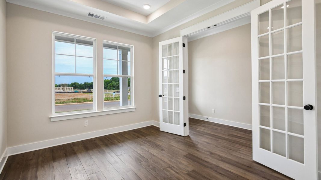 Study with French doors and tray ceiling Study with French doors and tray ceiling
