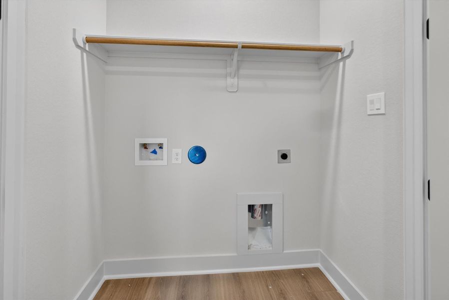 Full sized laundry room with built in shelving. Full sized laundry room with built in shelving.