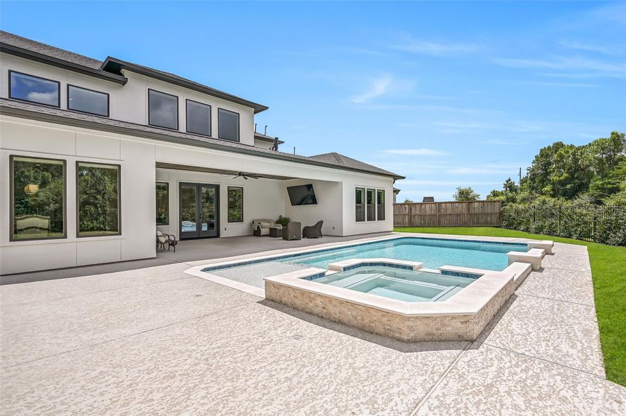 Designed as a true backyard retreat, the Aqua Sport pool features a large raised spa, wide tanning ledge and clean contemporary lines, surrounded by expansive decking with plenty of grassy yard remaining.