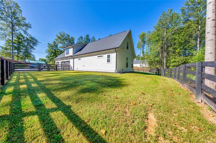 Front exterior of a new home in , Woodstock, GA, highlighting curb appeal (Image 22).