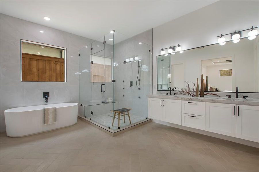 Bathroom with vanity and separate shower and tub