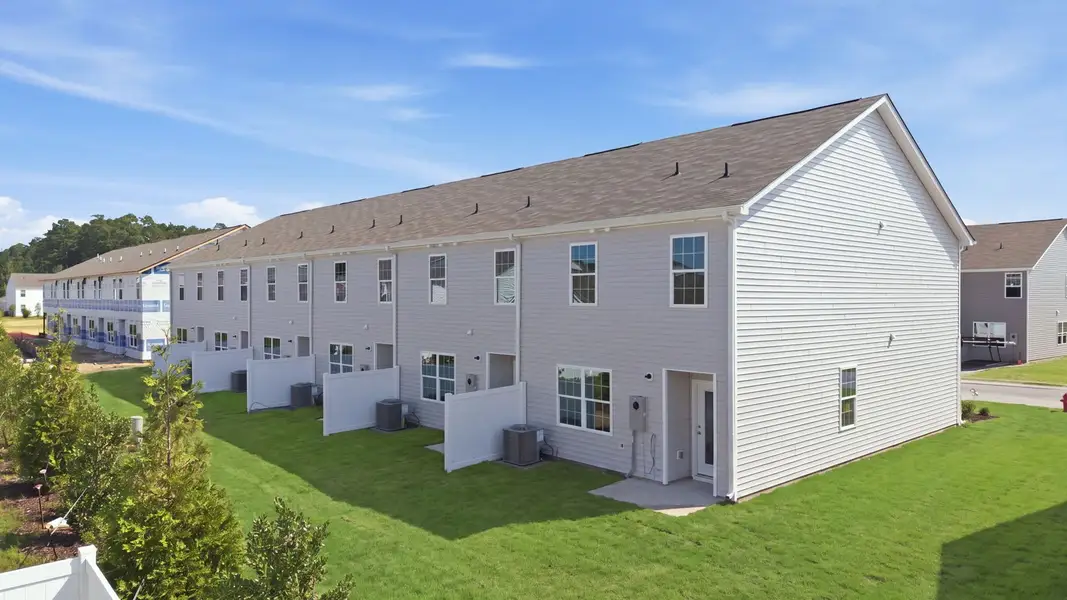 Exterior details and patio area of a home in The Townes at Ridgewood Farms, Winterville (Image 4).