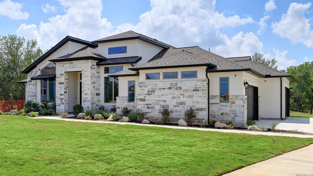 Front exterior of a new home in Megan's Landing, Castroville, TX, highlighting curb appeal (Image 29).