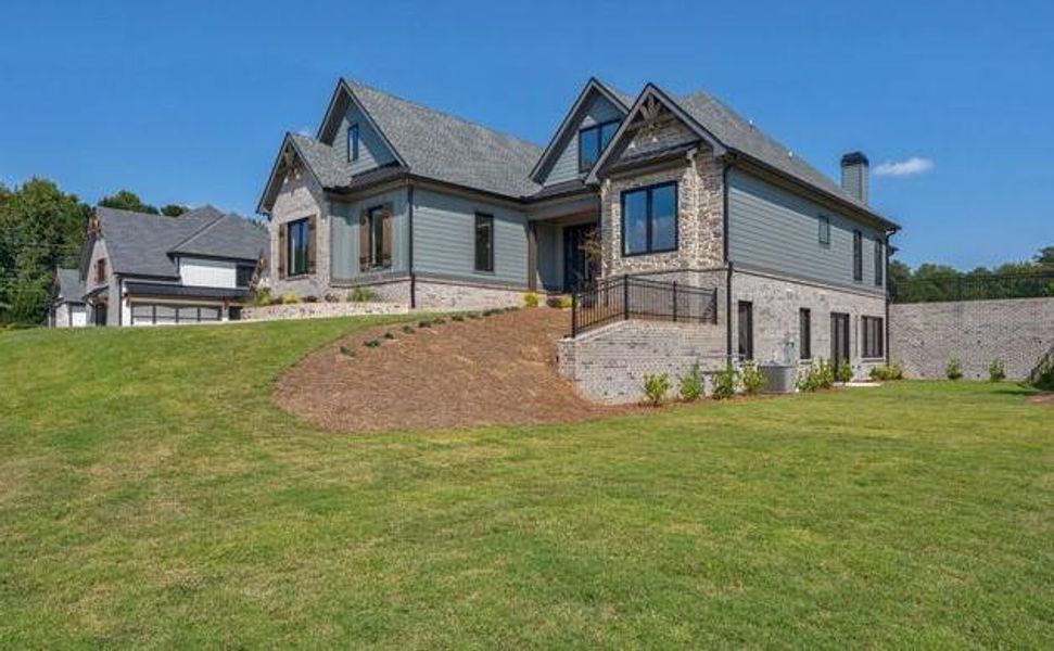 Front exterior of a new home in , Cumming, GA, highlighting curb appeal (Image 42).