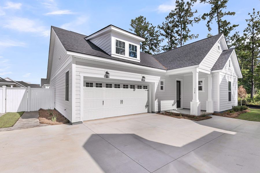Front exterior of a new home in Nexton – Midtown – The Garden Collection, Summerville, SC, highlighting curb appeal (Image 21).