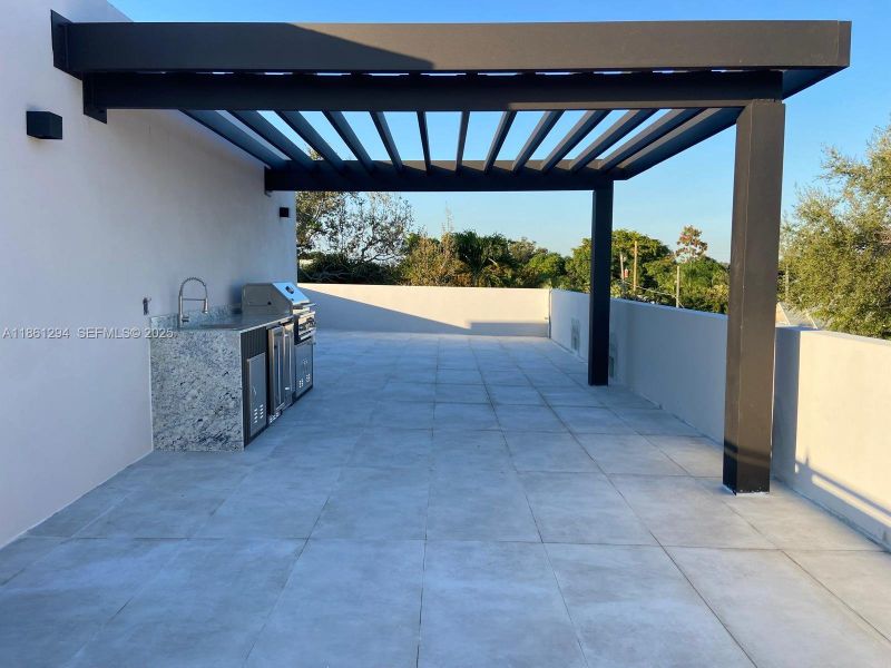 Exterior details and patio area of a home in , Miami (Image 3).