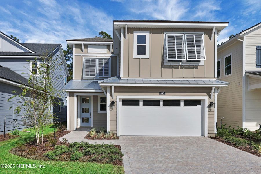 Front exterior of a new home in Crosswinds at Nocatee, Ponte Vedra, FL, highlighting curb appeal (Image 26).