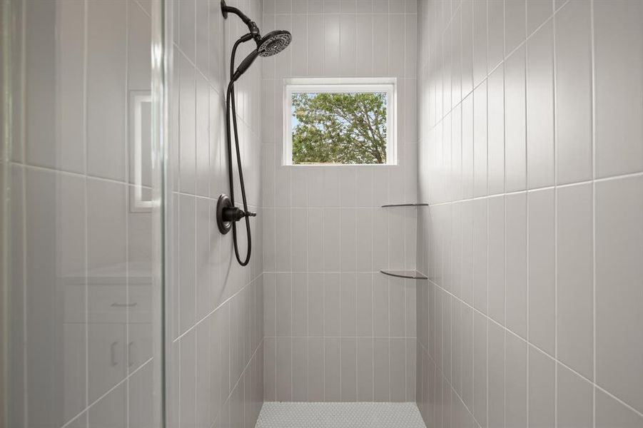 Full bathroom featuring a shower stall