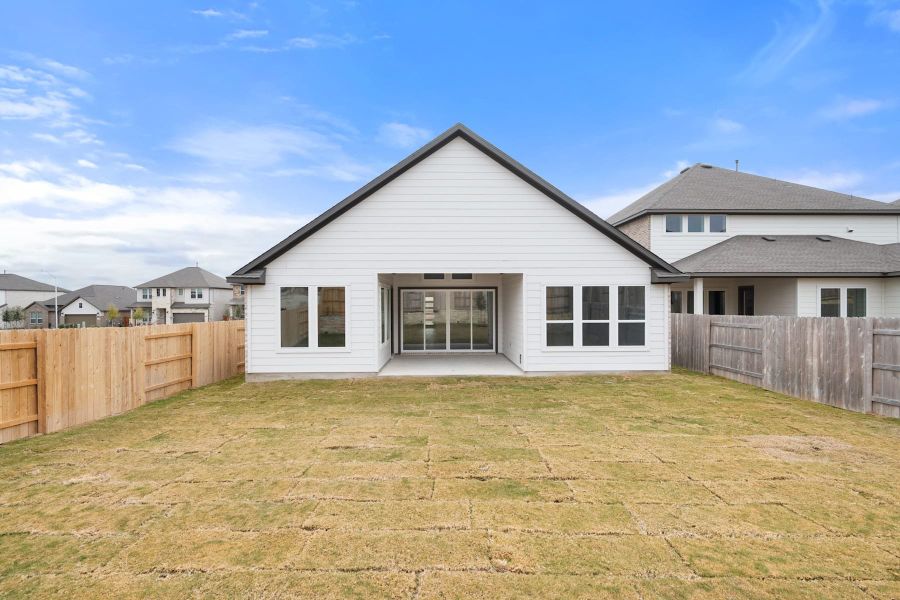 Exterior details and patio area of a home in Lariat, Liberty Hill (Image 28).