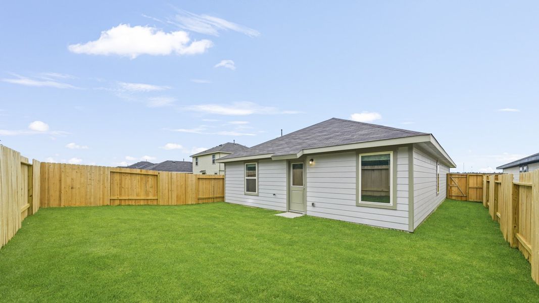 Exterior details and patio area of a home in The Canopies, Splendora (Image 3).