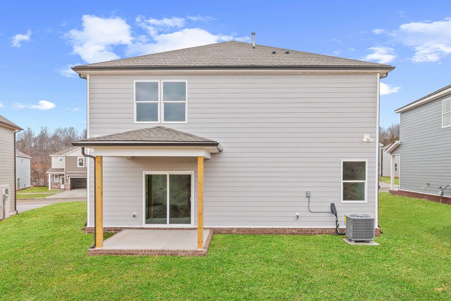 A small house with a small garage.