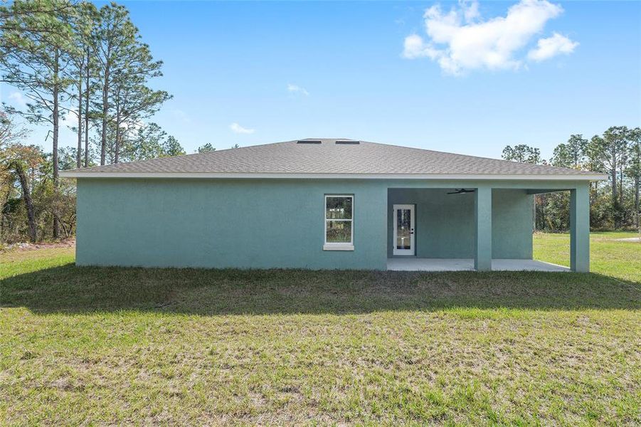 Exterior details and patio area of a home in , Citrus Springs (Image 24).