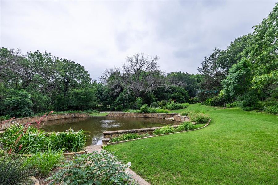 Stone walled gorgeous pond in the middle of the acreage to enjoy or fish