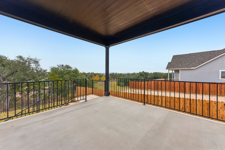 A walkway with a fence and trees. A walkway with a fence and trees.
