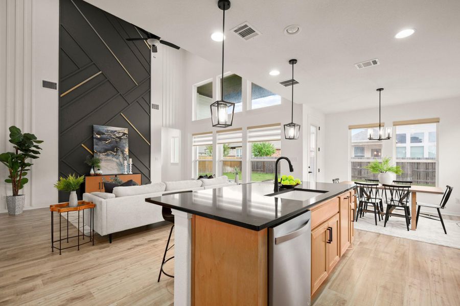 Excellent storage with bountiful natural wood cabinetry complete with and pull-out drawers for pots and pans, plus a cafe counter and pantry along the access point to the dining room. Excellent storage with bountiful natural wood cabinetry complete with and pull-out drawers for pots and pans, plus a cafe counter and pantry along the access point to the dining room.