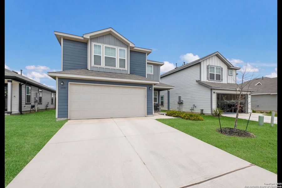 Front exterior of a new home in Winding Brook, San Antonio, TX, highlighting curb appeal (Image 26).